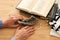 Jewish man hands next to Prayer book, praying, next to tallit. Jewish traditional symbols. Rosh hashanah jewish New Year holiday