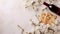 Jewish matzah, a bottle of wine and spring flowers on a white background, Passover