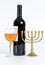 The Jewish menorah, bottle of wine and a glass