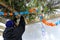 Jewish Orthodox man decorating a Sukkah