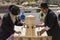 Jewish Orthodox men at Wailing Wall filling mug with drinking water, Jerusalem Israel