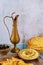 Jewish party table with hummus, bread and copper jug