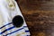 Jewish prayer items tallit and kippa on a wooden table