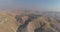 Jewish settlement at the desert of Judea and Samaria in Israel . Aerial view drone shot of village Houses on top hill