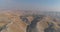 Jewish settlement at the desert of Judea and Samaria in Israel . Aerial view drone shot of village Houses on top hill