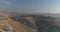 Jewish settlement at the desert of Judea and Samaria in Israel . Aerial view drone shot of village Houses on top hill