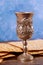Jewish silver cup with wine with matzos. Passover concept