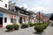 Jiangwan in Wuyuan County, Jiangxi Province, China. Wide street with red lanterns and green bushes.