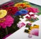 Jigsaw puzzle of colorful flowers with two pieces out