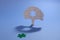 Jigsaw puzzle tree with green missing piece