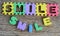 Jigsaw written smile word on wood background