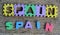 Jigsaw written Spain word on wood background
