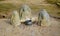 Jizo statues with coin offerings in Kinkaku-Ji temple, Kyoto, Japan