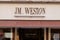 Jm weston shop brand logo and text sign front facade entrance luxury store