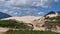 Joaquina beach with stone and dunes in Florianopolis, Santa Catarina, Brasil.