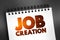 Job Creation text on notepad, business concept background