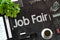 Job Fair Concept on Black Chalkboard. 3D Rendering.
