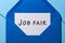 Job Fair - text message in blue envelope