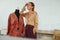 Job. Fashion Designer At Workshop. Happy Tailor Standing Near Mannequin And Touching Face. Success Woman In Stylish Clothes