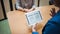 Job interview. The recruiter holds a tablet with a check list of the necessary skills of the candidate.