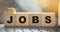 Jobs word Word Written In Wooden Cubes. Business concept