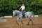 Jockey in glasses rides horse