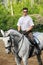 Jockey in glasses seat on horse