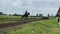 The jockeys are training their horses to prepare for horse racing on the track. Seen the horse being invited to run fast and walk.