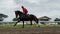 The jockeys are training their horses to prepare for horse racing on the track. Seen the horse being invited to run fast and walk.