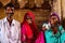 Jodhpur, India - August 20, 2009: three Indians pose in traditional clothing and jewels inside the fort of Jodhpur, India