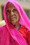 Jodhpur, India, september 10, 2010: Old indian woman face in pink sari.