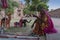 Jodhpur, Rajasthan, India - 19th October 2019 : Old aged Rajasthani woman selling hand made Rajaasthani colourful dolls of horse