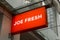 Joe Fresh sign in front of the building