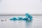 Joekulsarlon Glacier Lagoon deep blue ice with layers of volcanic ash next to boats