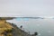 Joekulsarlon Glacier Lagoon deep blue iceberg drifting towards shore line