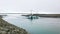 Joekulsarlon Glacier Lagoon deep blue icebergs in front of suspension bridge