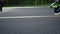 Jogger with artificial limb exercising on running surface. Girl doing cardio