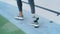 Jogger with artificial limb exercising at stadium. Girl doing cardio outdoors