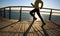 Jogger morning exercise on seaside boardwalk