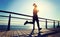 Jogger morning exercise on seaside boardwalk during sunrise