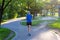 Jogger runs along the Lake of the Isles trail in Minneapolis