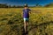 Jogger runs through Super Bloom spring flowers off Shell Creek Road, San Luis Obisbo County, California