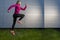 Jogging Concepts. Running Mature Sportswoman Having Outdoor Jogging Training Against Abstract Metal Wall Background