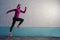 Jogging Concepts. Running Mature Sportswoman Having Outdoor Jogging Training Against Concrete Wall Background