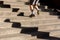 Jogging up the stairs with long shadows