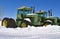 John Deere 7520 tractors in the snow