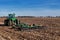 John Deere 9220 tractor pulling a John Deere 512 disk ripper