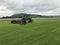 John Deere mowing field of turf