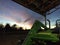 John Deere Tractor parked in open sided shed on the farm