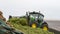 John Deere tractor pushing silage at the clamp